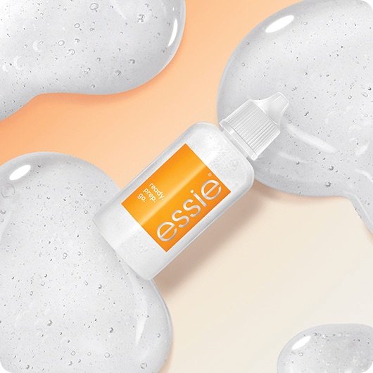 Essie „Ready, Prep, Go“ Pflegeprodukt in einer Tube auf hellem Hintergrund mit transparenten Gelklecksen.